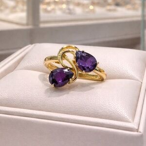 Elegant Gold Ring with Purple Stones